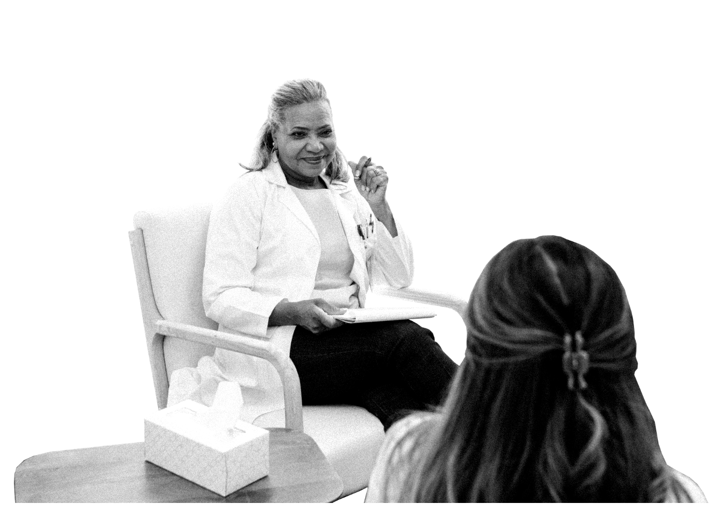 A clinician in conversation with a patient during an admission review